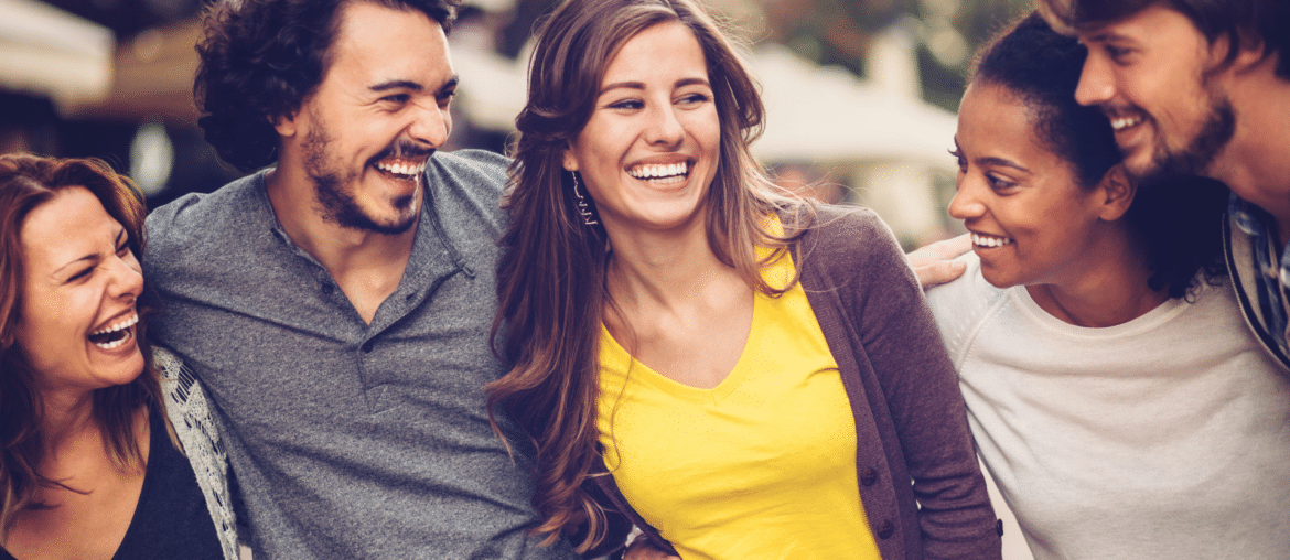 Image of a group of happy people smiling