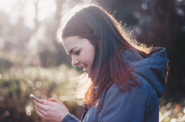 women purchasing on phone black friday ecommerce strategy