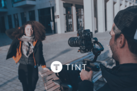 filming video content in an urban center with TINT overlay