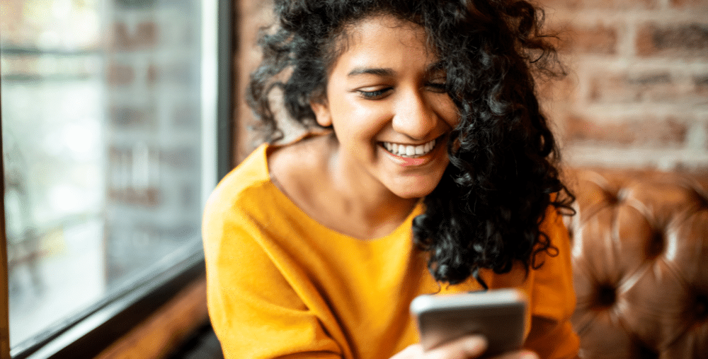 Smiling woman on mobile phone