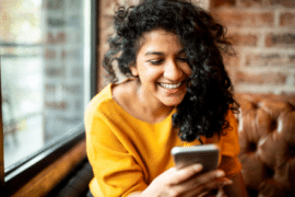 Smiling woman on mobile phone