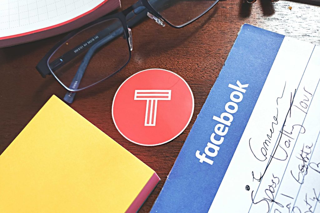 Workstation of a social commerce specialist, note, glasses, sticker.