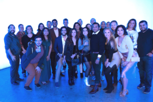 Picture of TINT's small startup team at an art gallery