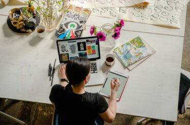 Woman drawing on computer making content