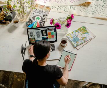 Woman drawing on computer making content