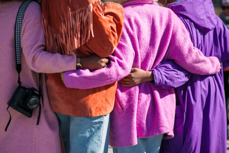 A group of friends hugging