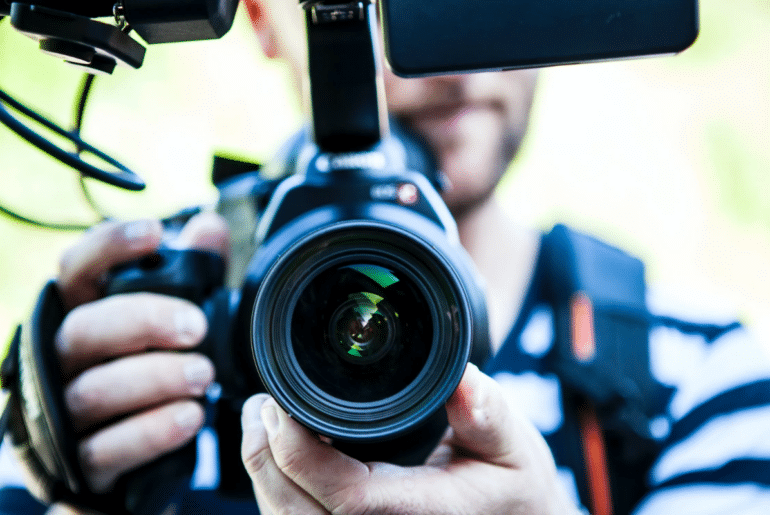 A person pointing a camera