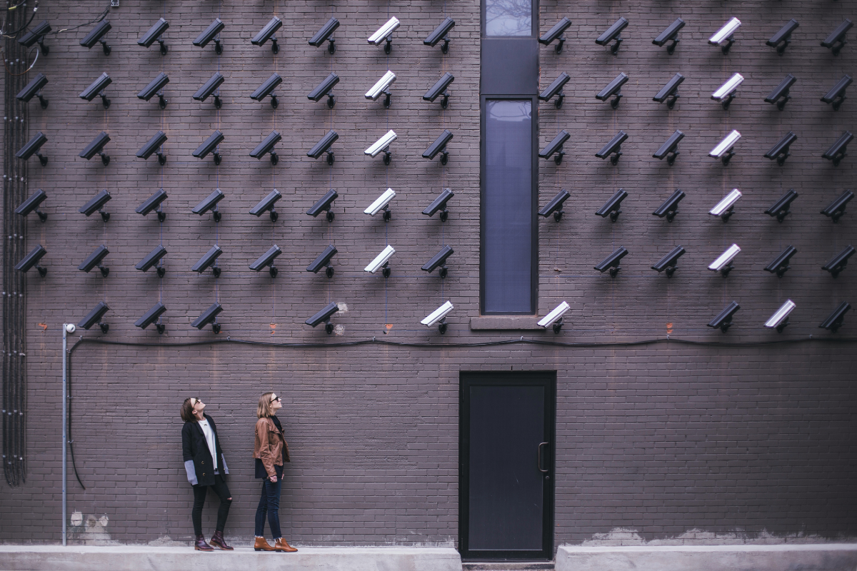 Many security cameras pointing down at two women