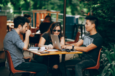 A group of people on their laptops