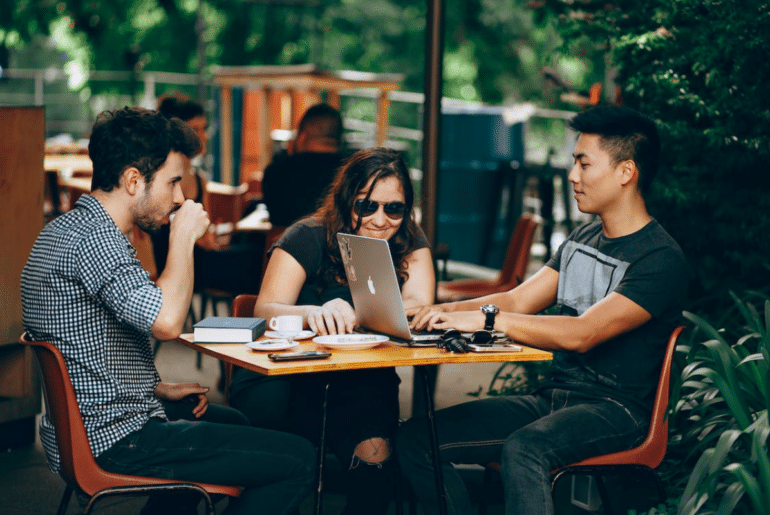 A group of people on their laptops