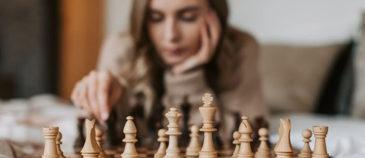 A woman playing chess