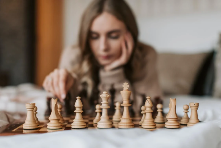 A woman playing chess