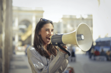 A woman speaking into a megaphone