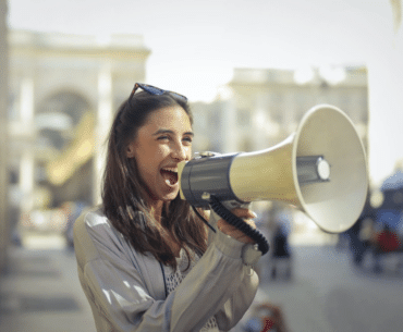 A woman speaking into a megaphone