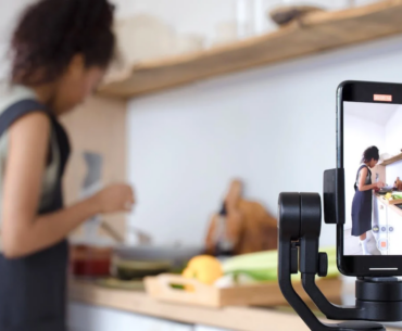 A woman filming herself cooking