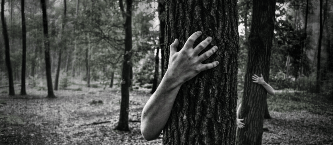 Zombie hand hugging a tree