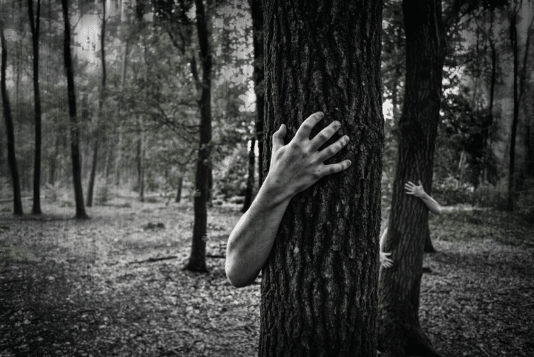 Zombie hand hugging a tree