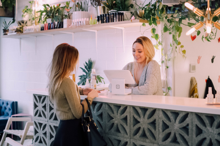 Two women at a cash register