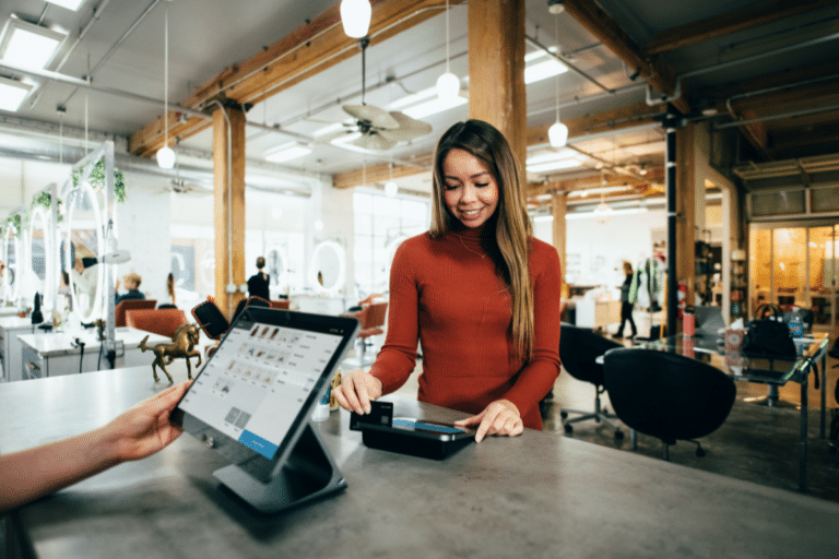 A woman paying at a cash register