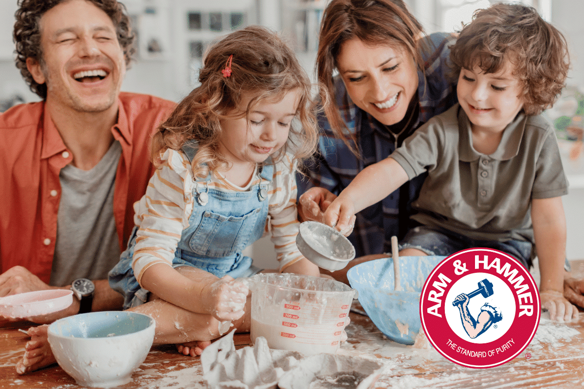 Family cooking together alongside the ARM & HAMMER logo