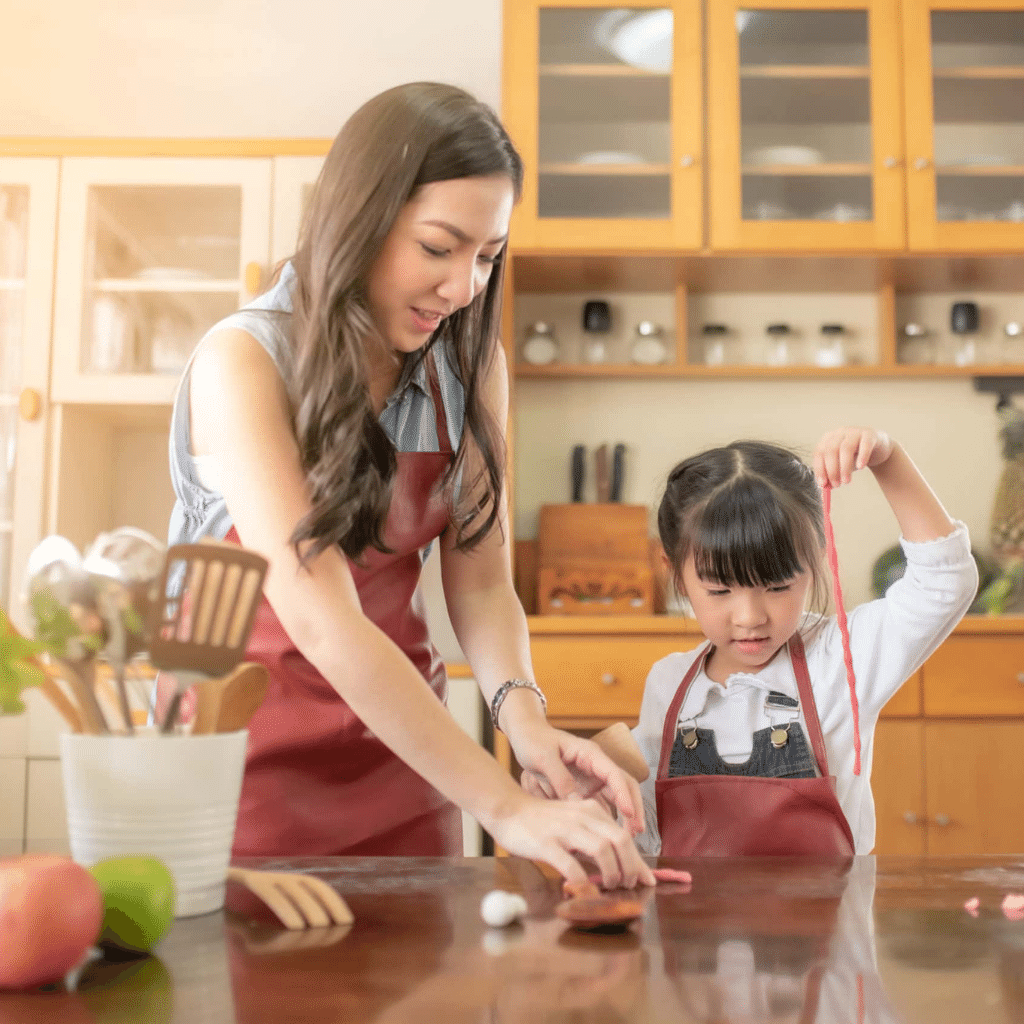 Mother and child crafting in kitchen