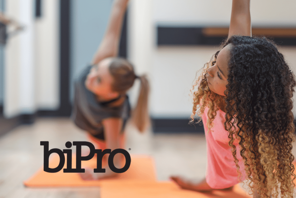 Women in workout class with BiPro logo