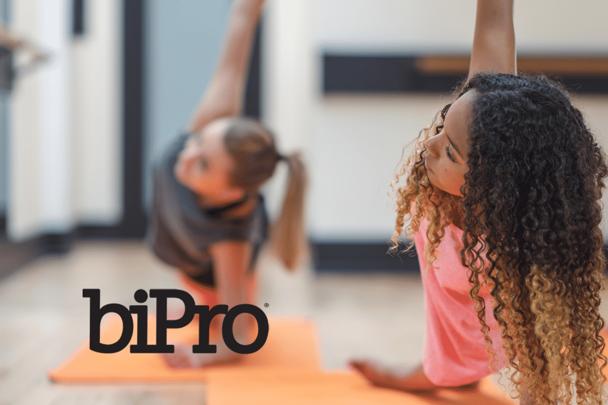 Women in workout class with BiPro logo
